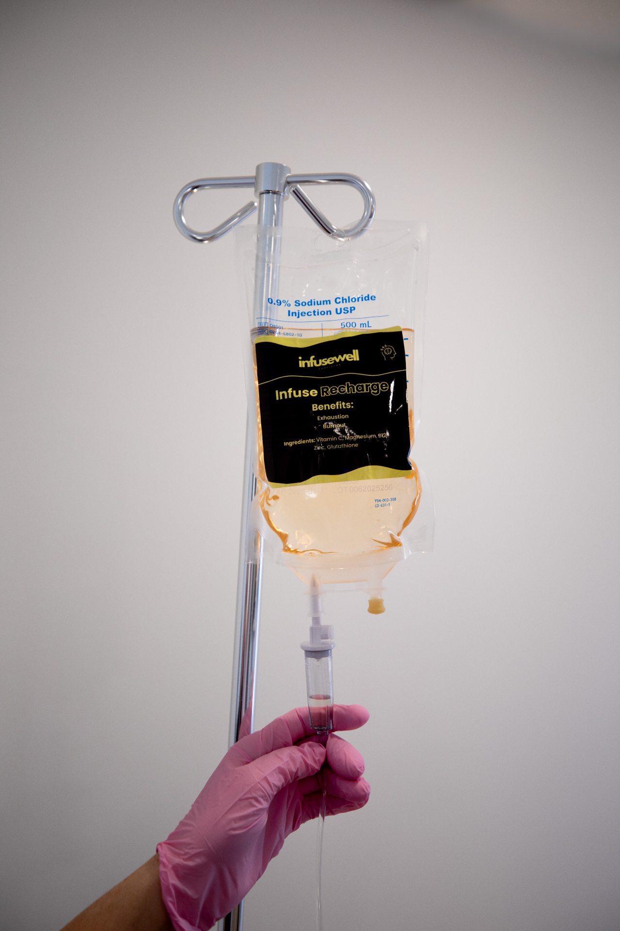 A vitamin-infused IV bag in a calm wellness setting