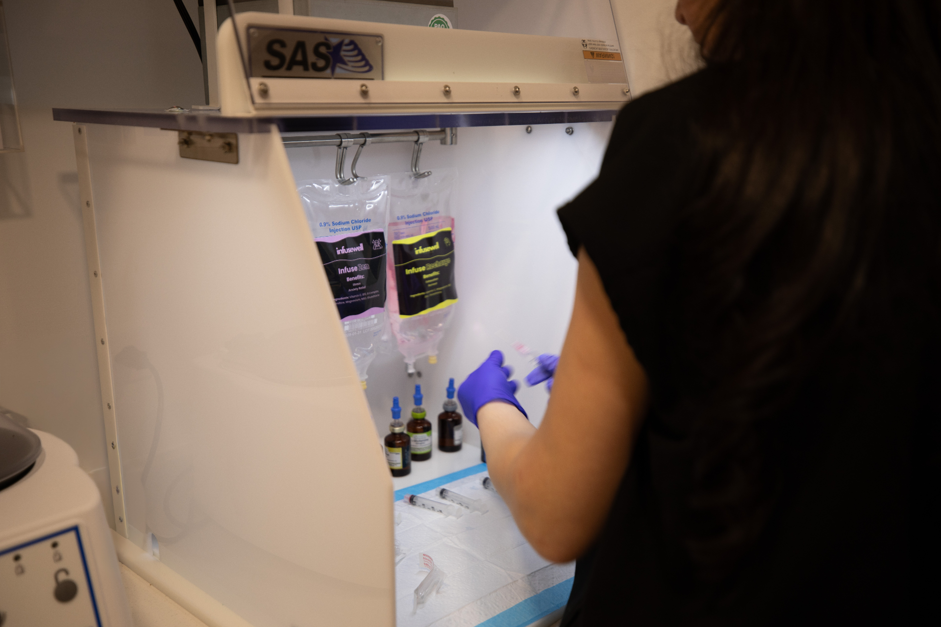 Licensed clinician preparing an IV line